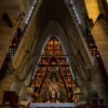 Inside the Basilica de la Altagracia The soaring concrete arches and stained glass above the altar inside the Basilica of Higuey