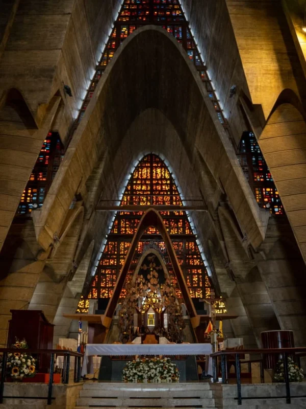Inside the Basilica de la Altagracia The soaring concrete arches and stained glass above the altar inside the Basilica of Higuey